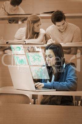 Pretty brunette studying on her futuristic computer