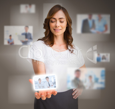 Businesswoman presenting picture of coworkers