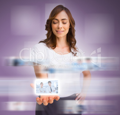 Classy businesswoman presenting picture of coworkers