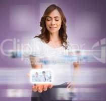 Classy businesswoman presenting picture of coworkers