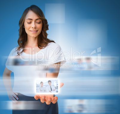 Stylish businesswoman presenting picture of coworkers