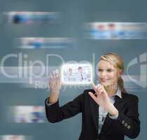 Blonde businesswoman touching digital interface