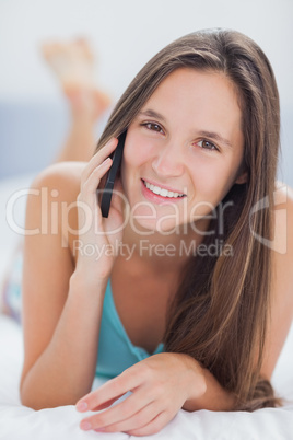 Smiling woman in bed