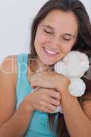 Woman holding a teddy bear