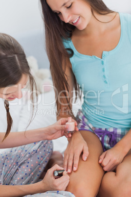 Girls painting each others nails