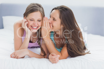 Girls lying in bed