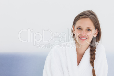 Smiling woman in bathrobe
