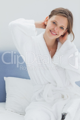 Attractive woman sitting on bed