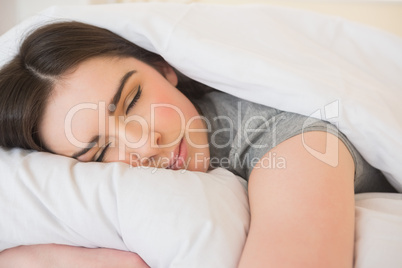 Calm girl sleeping in her bed