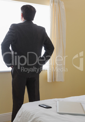 Man standing in front of window