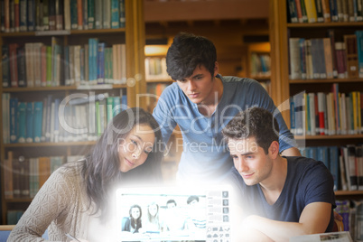 Content students watching pictures on digital interface