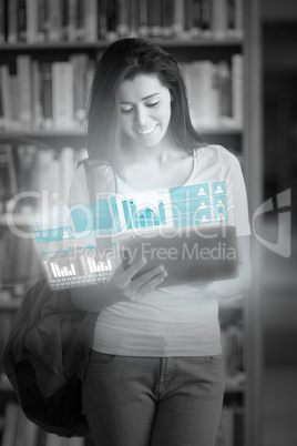 Cheerful pretty student working on her futuristic tablet