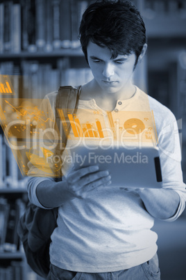 Concentrated handsome student working on his futuristic tablet