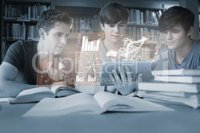 Serious young men studying medicine together with futuristic int