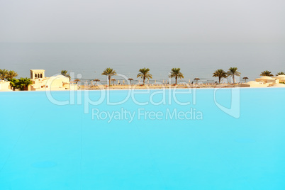 the view from swimming pool on a beach, ras al khaima, uae