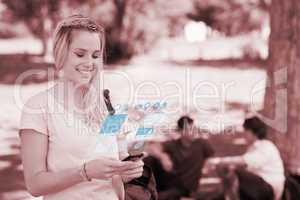 Cheerful pretty blonde working on her digital smartphone