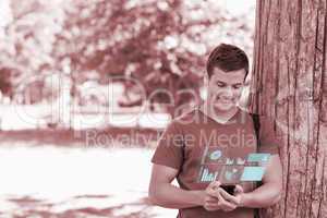 Happy handsome student using his digital smartphone