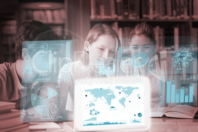 Cheerful college friends studying geography on digital interface