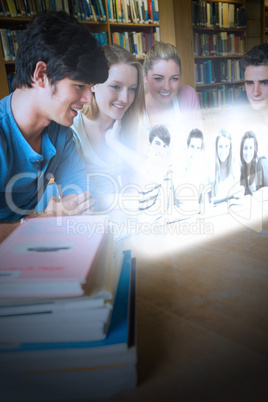 Happy college friends watching photos on futuristic interface