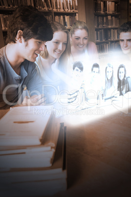 Smiling college friends watching photos on futuristic interface