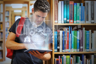 Handsome college student working on his digital tablet with futu