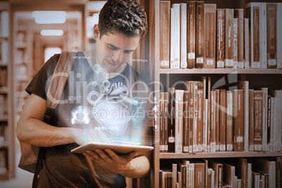 Handsome college student working on his digital tablet pc with f