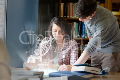 Concentrated college students analysing dna on digital interface