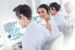 Pretty call center worker using futuristic interface hologram