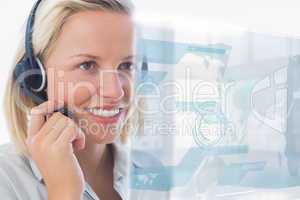 Blonde call center worker using futuristic holographic interface