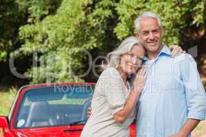 Cheerful mature couple posing