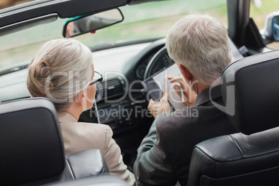 Business people working together in convertible
