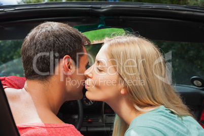 Attractive blonde kissing her boyfriend