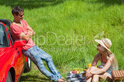 Cheerful couple having picnic together