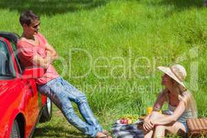 Cheerful couple having picnic together