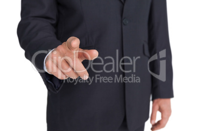 Businessman pointing finger at camera