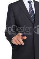 Businessman in suit pointing finger