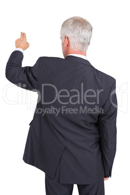 Rear view of stylish mature businessman pointing finger