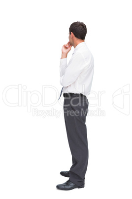 Thoughtful classy businessman looking away