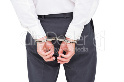 Close up on classy businessman wearing handcuffs