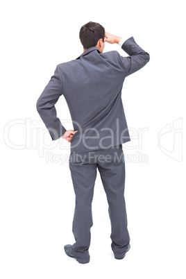 Rear view of young businessman looking away