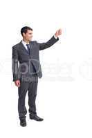 Smiling businessman holding something up in the air