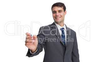 Smiling businessman holding marker and looking at camera