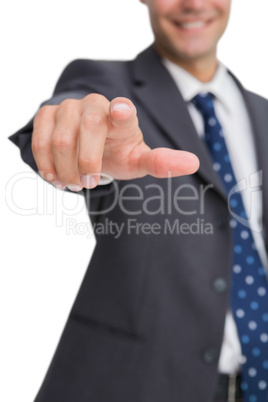 Finger of smiling businessman pointing