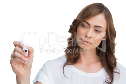 Concentrated businesswoman holding whiteboard marker