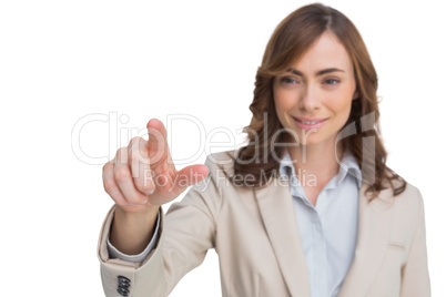 Portrait of businesswoman pointing her finger at camera