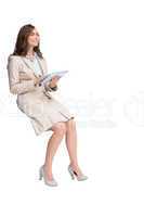 Businesswoman holding tablet and looking up