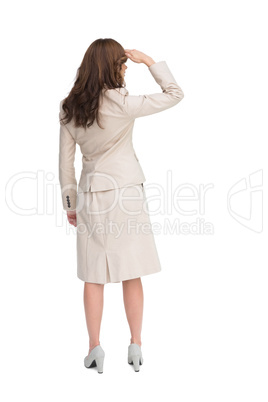 Rear view of young businesswoman looking away