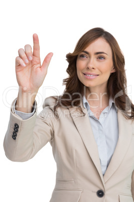 Young businesswoman touching invisible screen