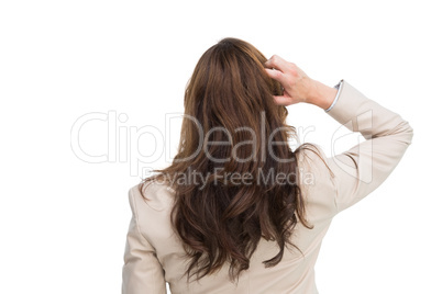 Rear view of classy businesswoman scratching her head