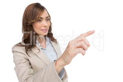 Businesswoman pressing an invisible key